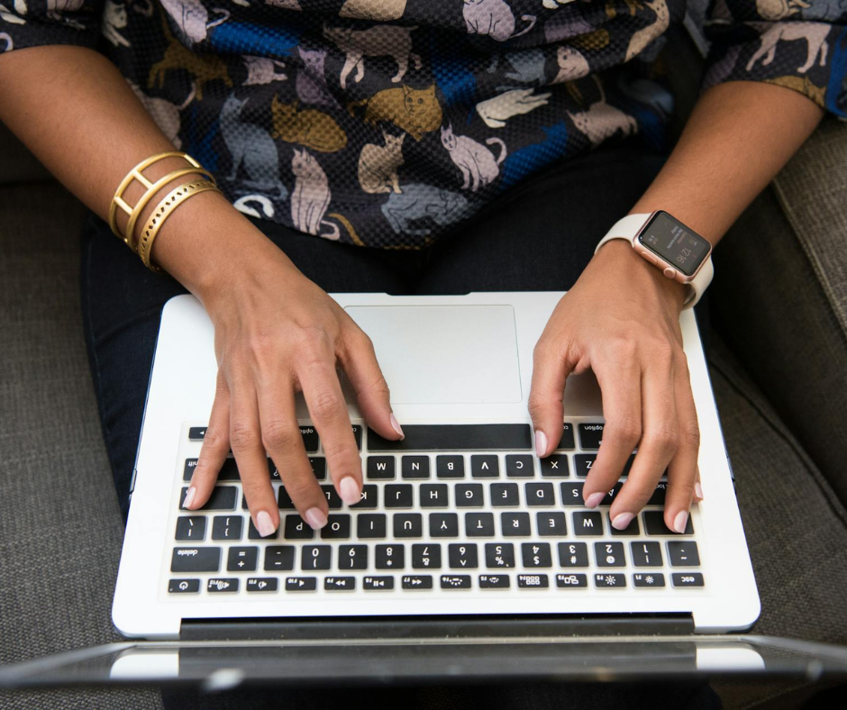 Woman typing on laptop