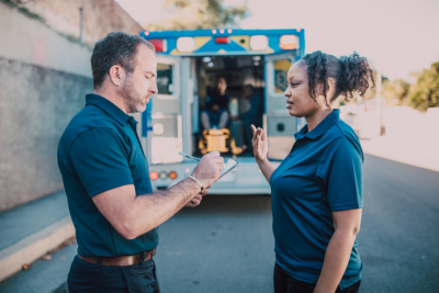 two emt workers talking