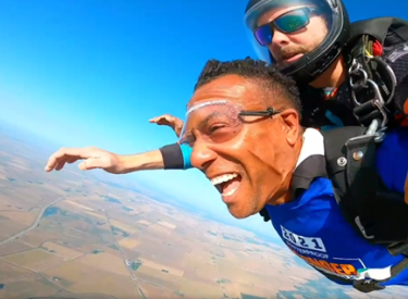 Challenge participants smiling while skydiving