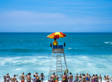 Lifeguard Stand on a Beach with People