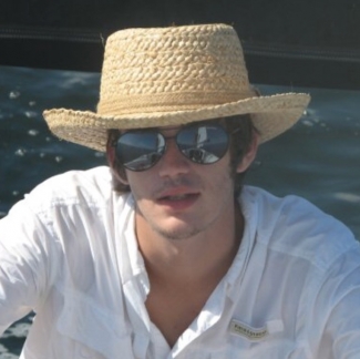 The author's friend, Brady, in a straw hat and sunglasses