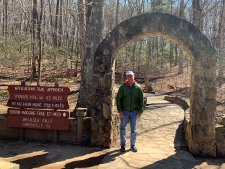 Steve Leker at the base of a hiking trail